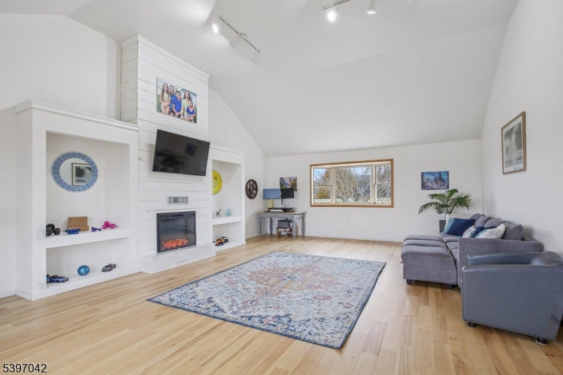 154 Lott Road Wantage, NJ 07461 - Photo 11 of 39 a living room with furniture and a flat screen tv