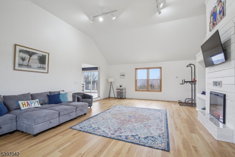 154 Lott Road Wantage, NJ 07461 - Photo 13 of 39 a living room with furniture and a fireplace