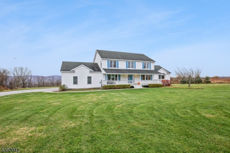 154 Lott Road Wantage, NJ 07461 - Photo 2 of 39 a front view of a house with garden