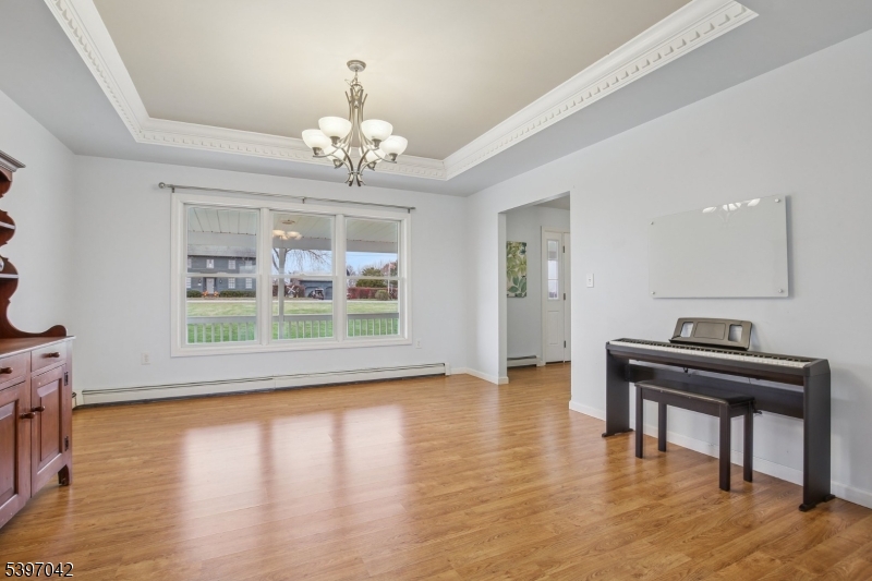 154 Lott Road Wantage, NJ 07461 - Photo 4 of 39 a view of an empty room with wooden floor and a window