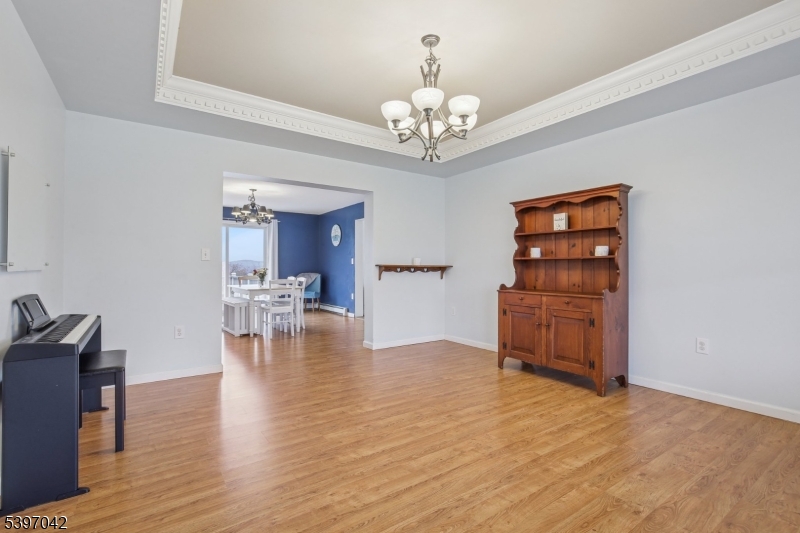 154 Lott Road Wantage, NJ 07461 - Photo 6 of 39 a view of a room with wooden floor chandelier and windows