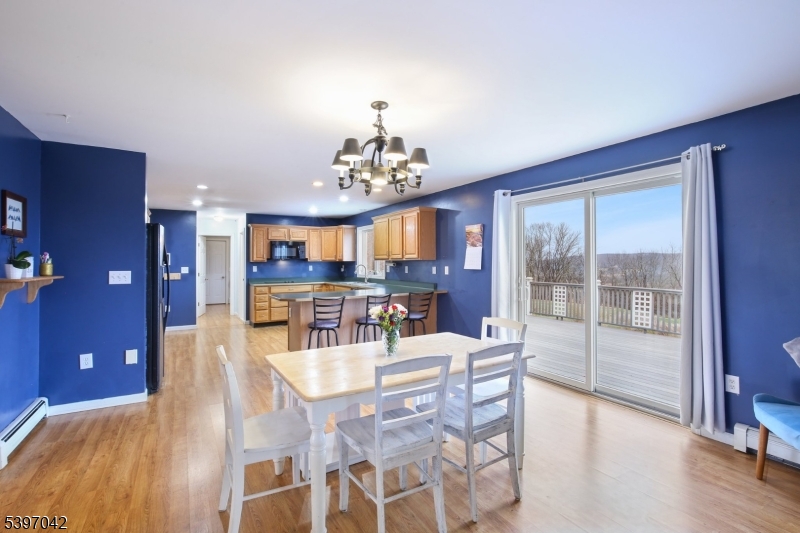 154 Lott Road Wantage, NJ 07461 - Photo 7 of 39 a view of a dining room with furniture wooden floor and chandelier