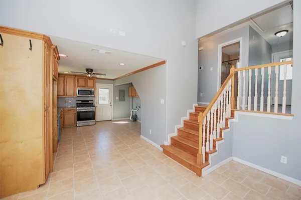 a view of entryway and kitchen