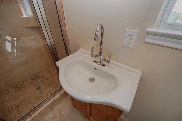 a bathroom with a sink and a mirror
