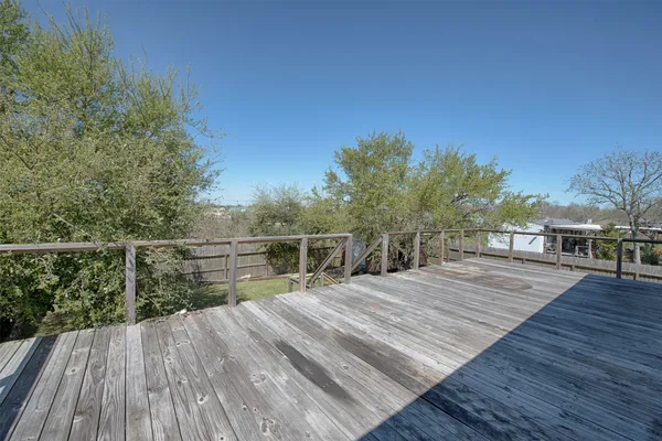 a view of balcony with deck and wooden floor