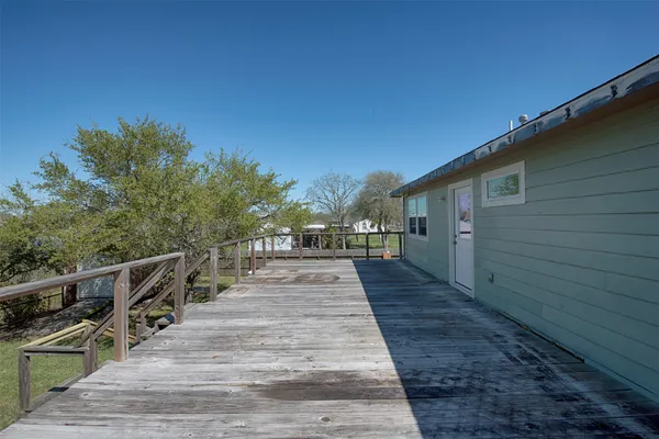 a view of a patio with wooden floor