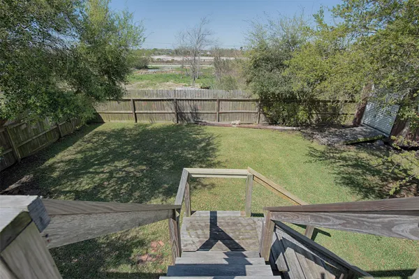 a view of swimming pool from a balcony