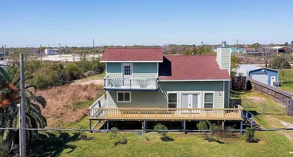 a aerial view of a house with swimming pool