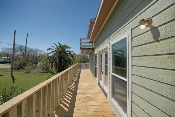 a view of balcony with yard