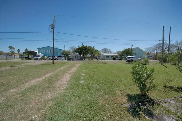 a view of a field with an ocean view