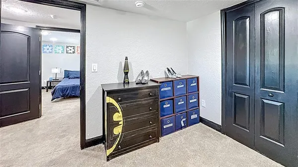 a bedroom with a bed and a dresser