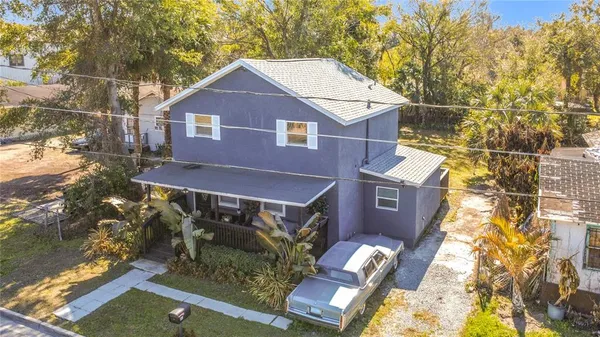 a aerial view of a house with a yard