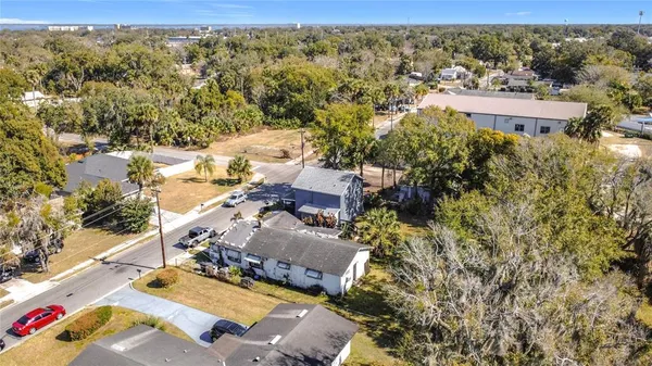 an aerial view of residential houses with outdoor space