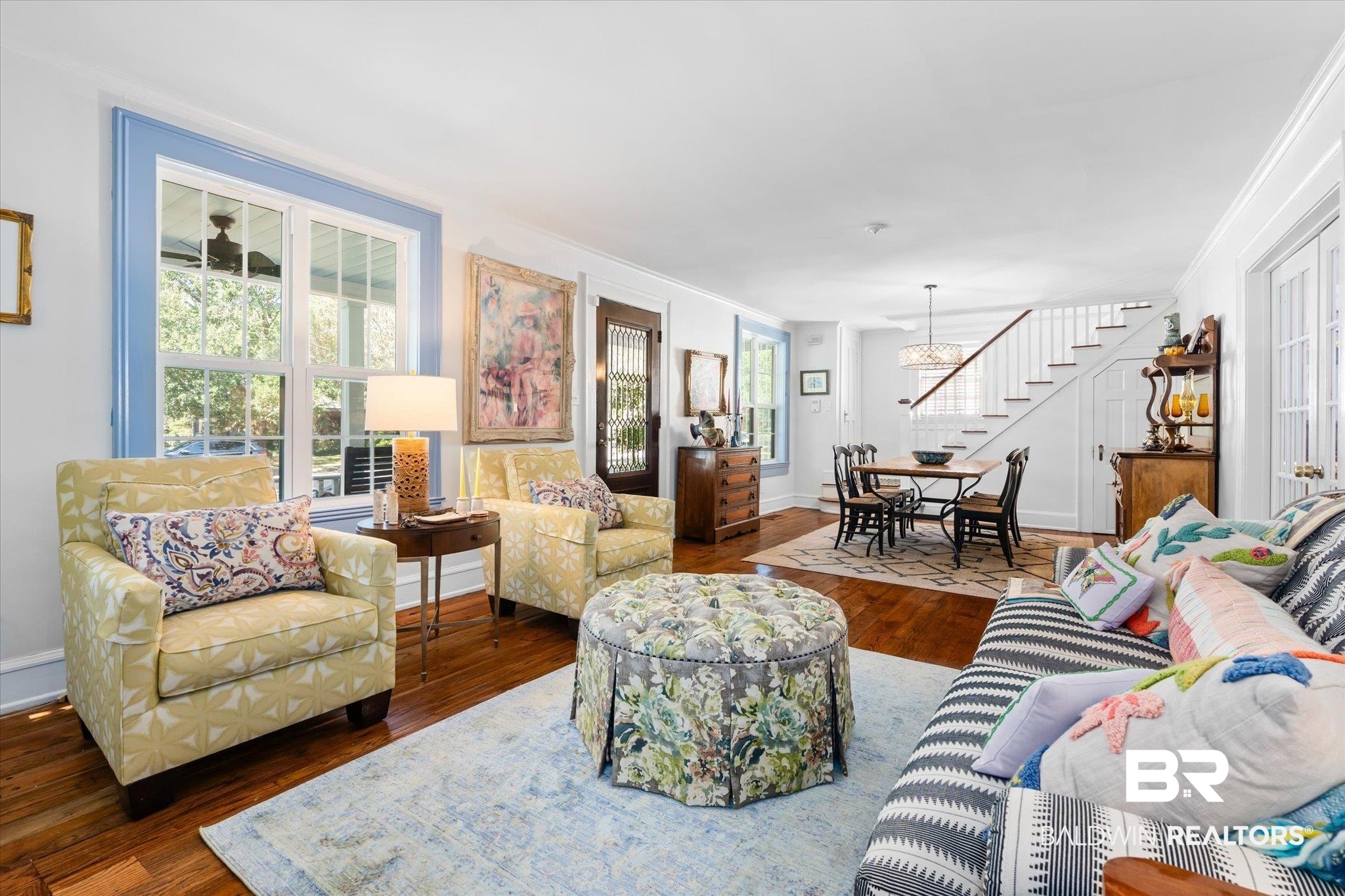 202 Woodlands Avenue Mobile, AL 36607 - Photo 7 of 53 Living room featuring dark wood-type flooring, a wealth of natural light, and an inviting chandelier