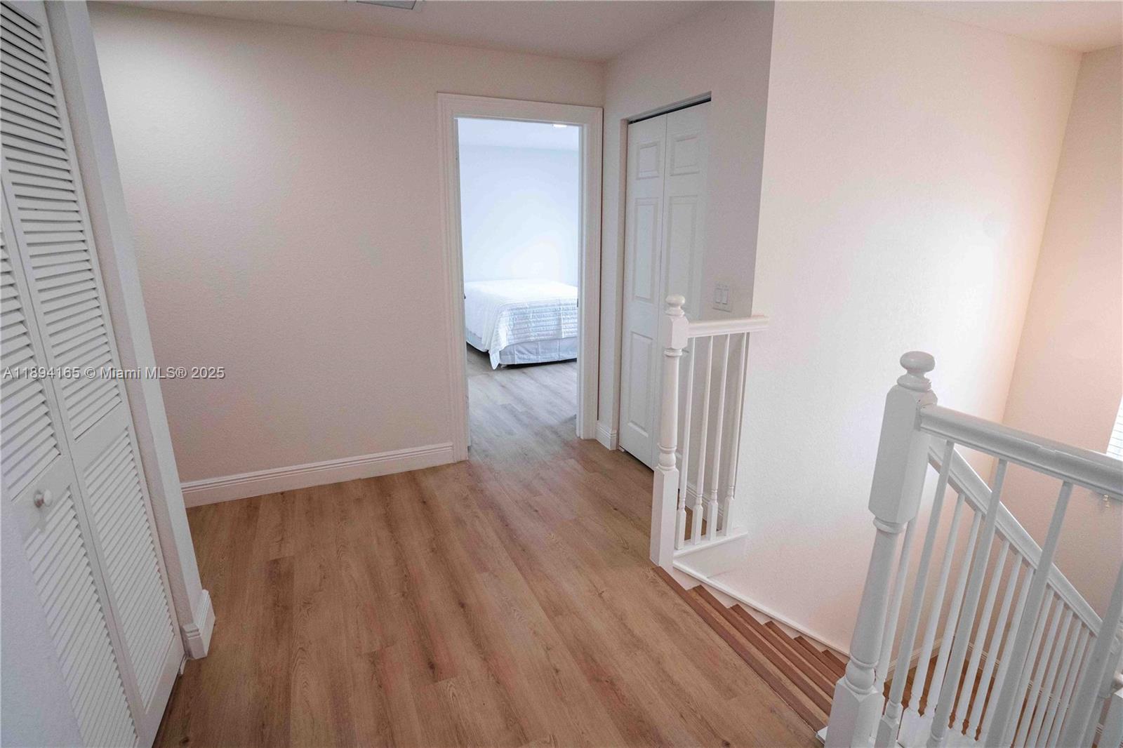 4537 Southwest 183rd Avenue Miramar, FL 33029 - Photo 11 of 46 a view of a hallway with wooden floor and staircase