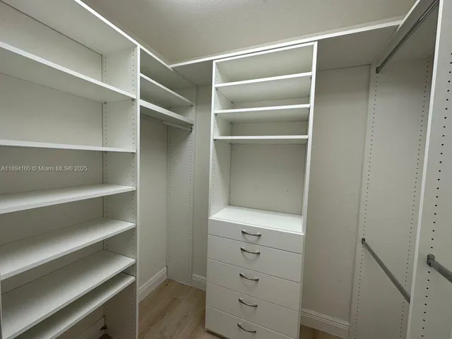 a view of an empty walk in closet
