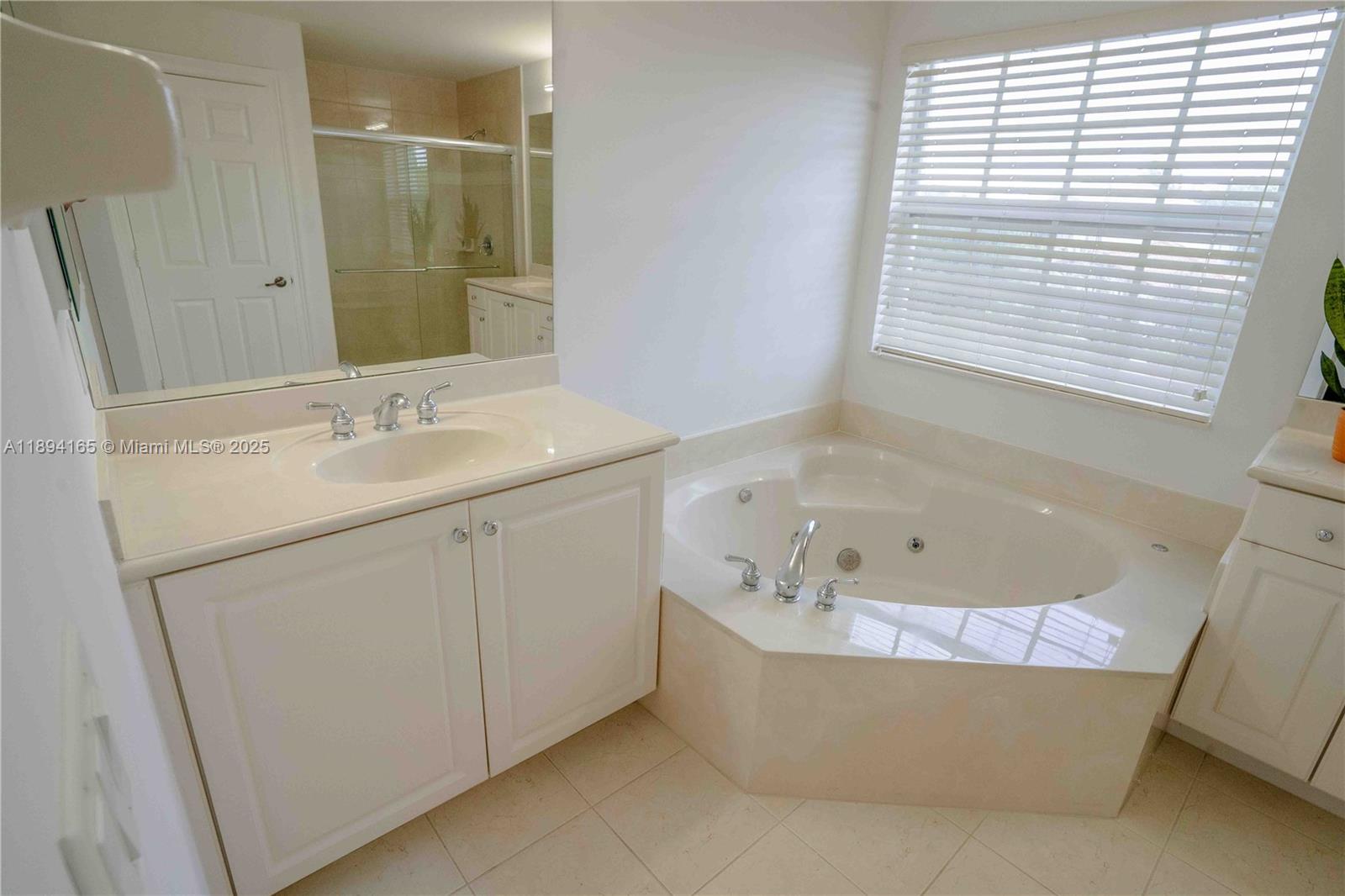 4537 Southwest 183rd Avenue Miramar, FL 33029 - Photo 15 of 46 a bathroom with a bathtub and a sink