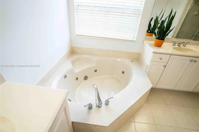a bathroom with a bathtub and a sink