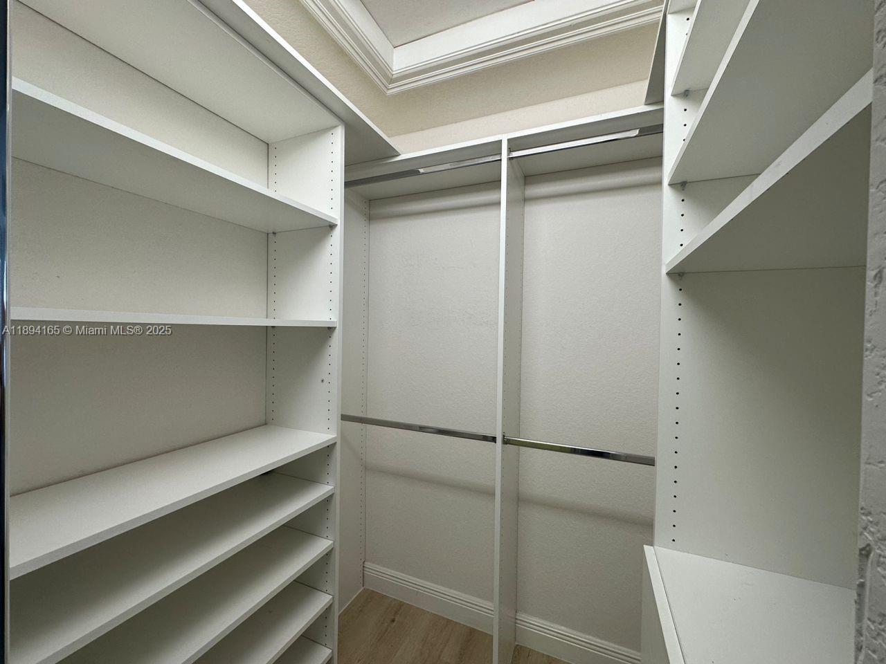 4537 Southwest 183rd Avenue Miramar, FL 33029 - Photo 23 of 46 a view of walk in closet with empty racks
