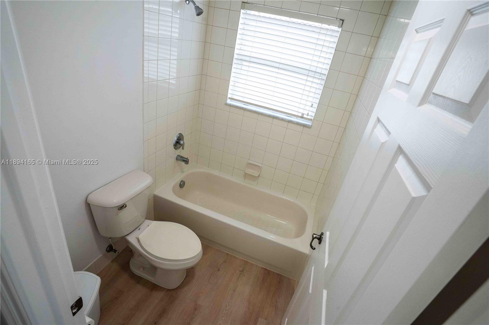 4537 Southwest 183rd Avenue Miramar, FL 33029 - Photo 24 of 46 a white toilet sitting next to a bath tub