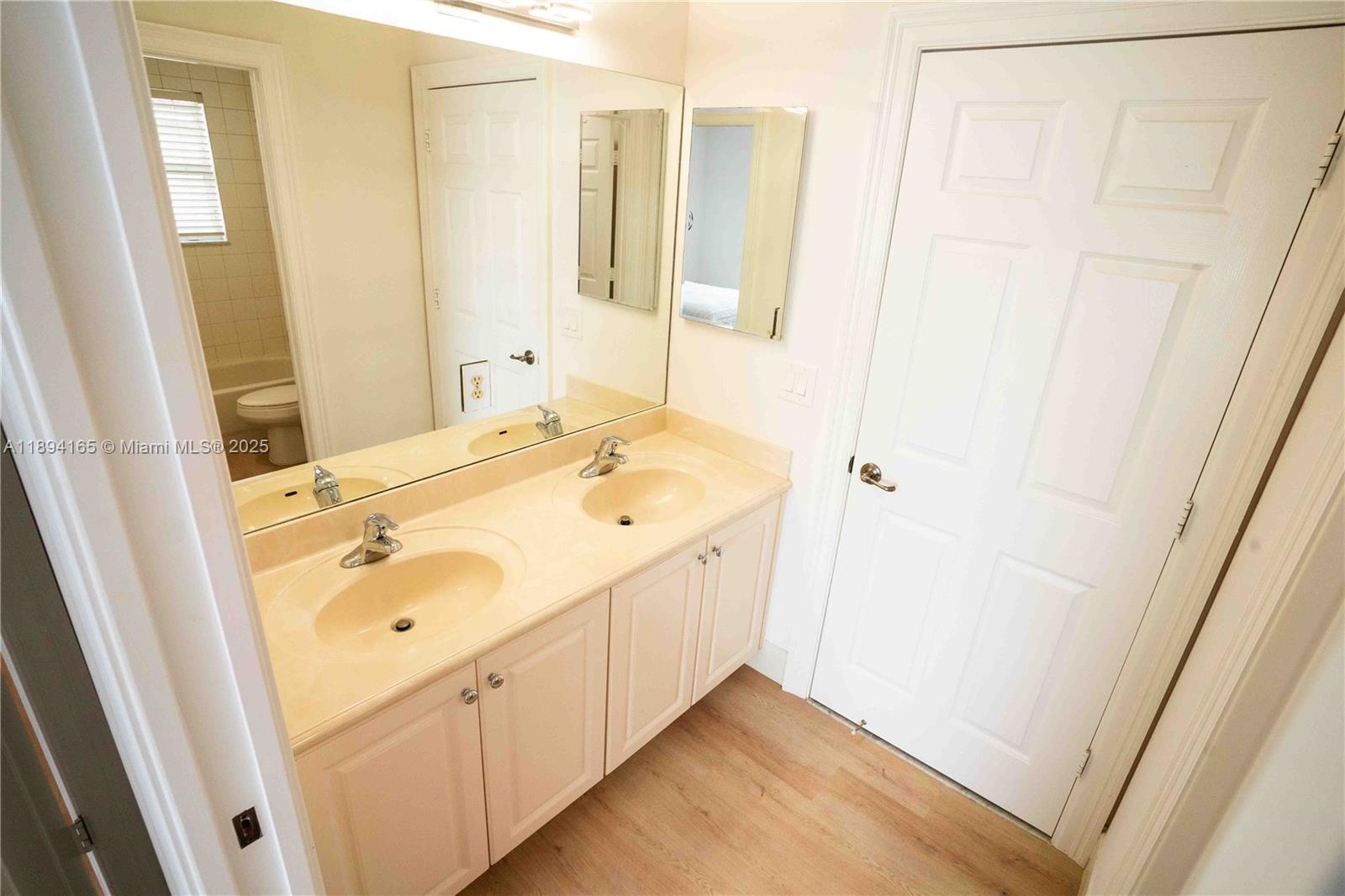 4537 Southwest 183rd Avenue Miramar, FL 33029 - Photo 25 of 46 a bathroom with a sink and a mirror