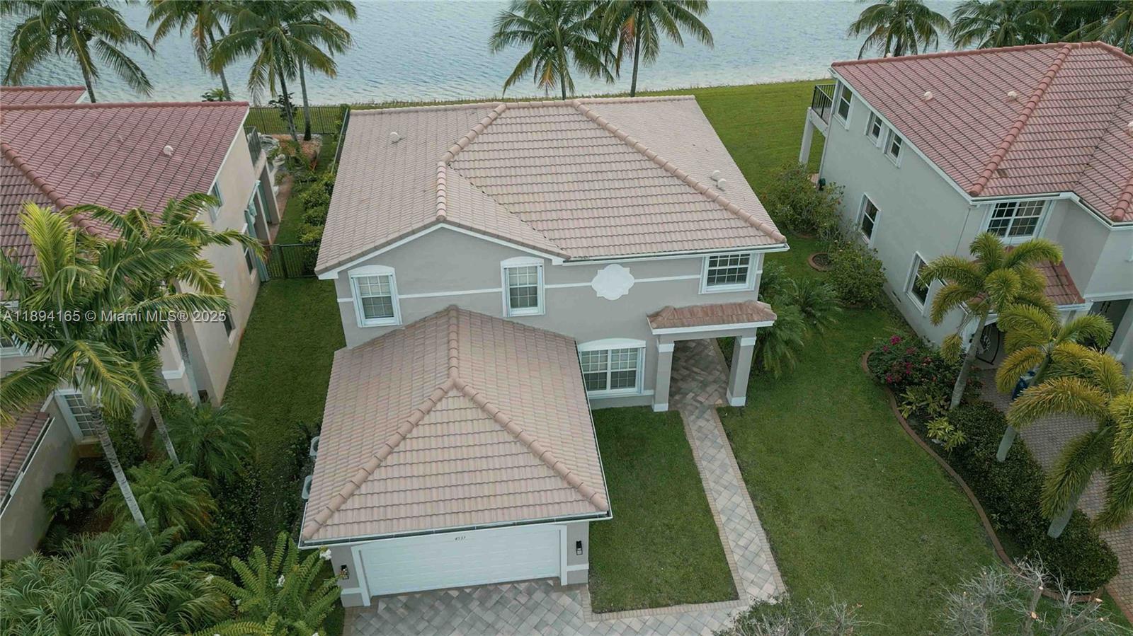 4537 Southwest 183rd Avenue Miramar, FL 33029 - Photo 34 of 46 a aerial view of a house with a yard patio and potted plants