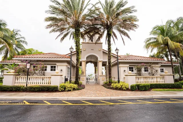 a view of a lake with houses in the back