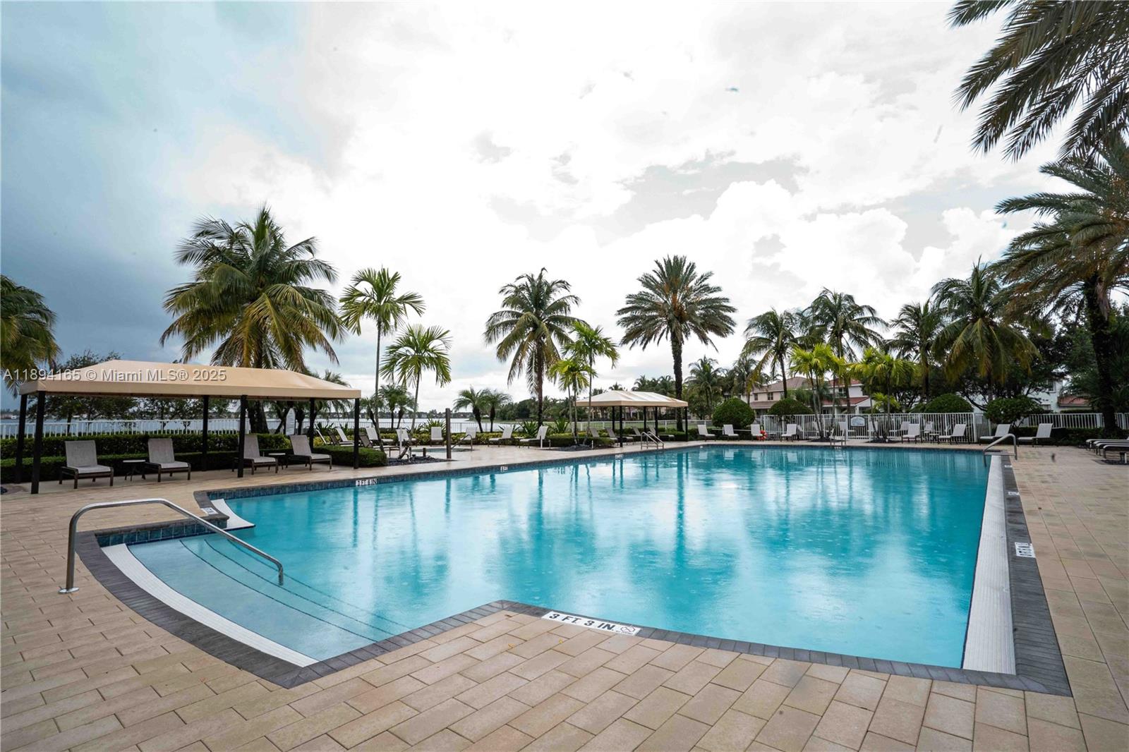 4537 Southwest 183rd Avenue Miramar, FL 33029 - Photo 43 of 46 a view of a lake with boats and palm trees