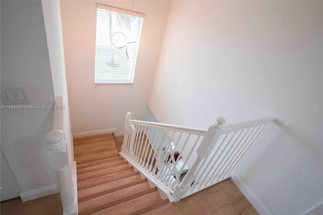 a view of entryway with wooden floor