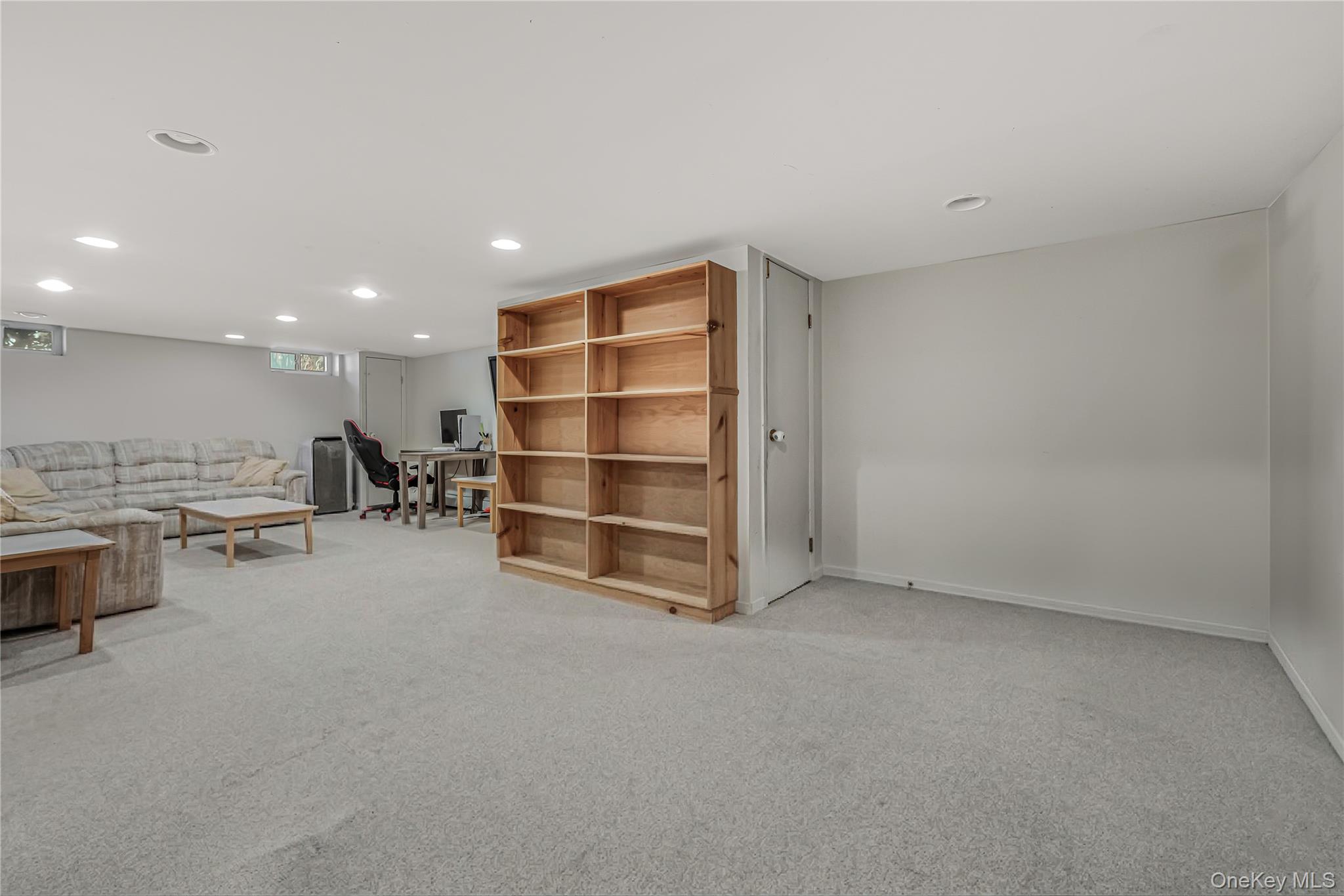 18 Woodland Road Roslyn, NY 11576 - Photo 18 of 21 a view of room with window and shelf