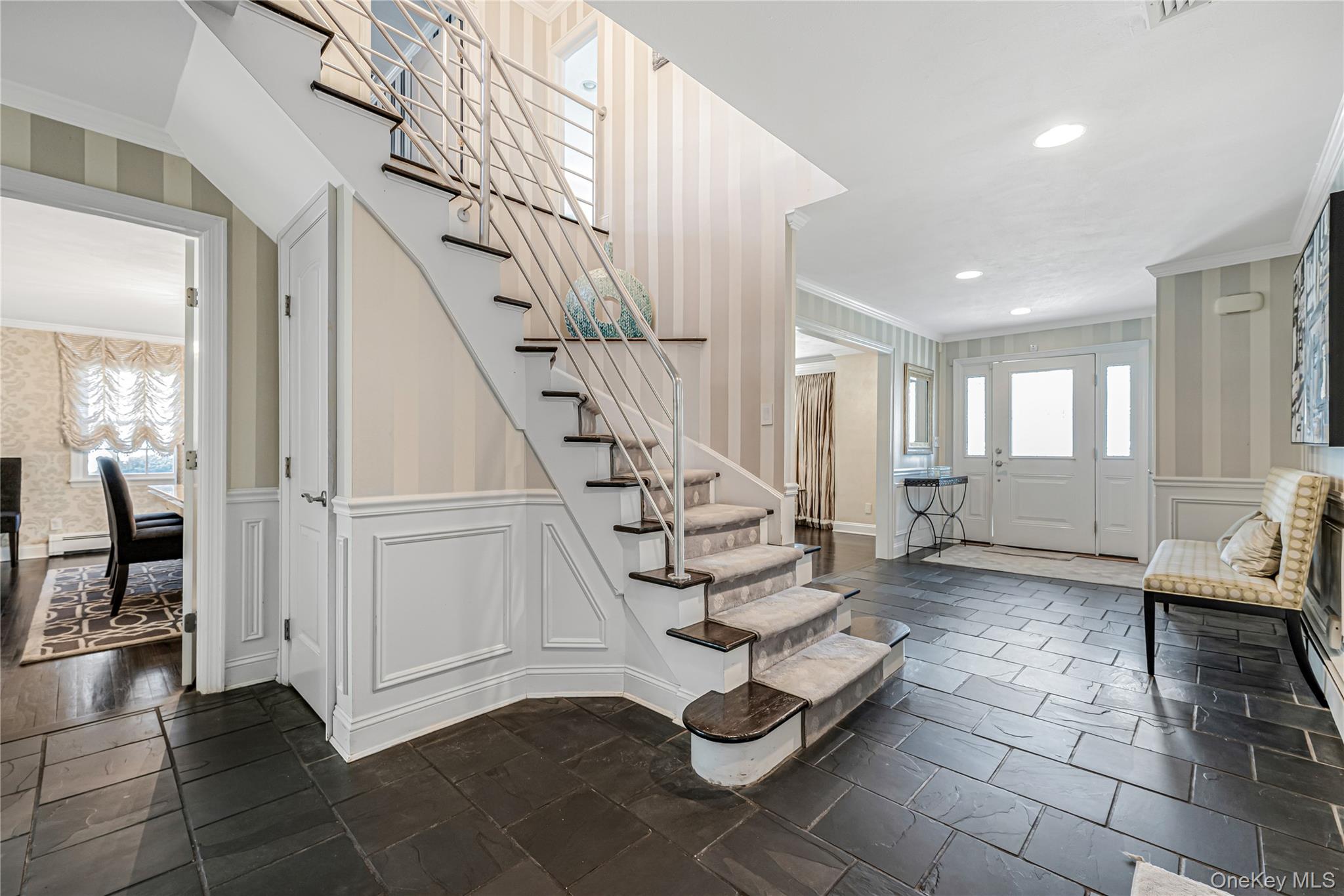 18 Woodland Road Roslyn, NY 11576 - Photo 2 of 21 a view of an entryway with wooden floor and windows