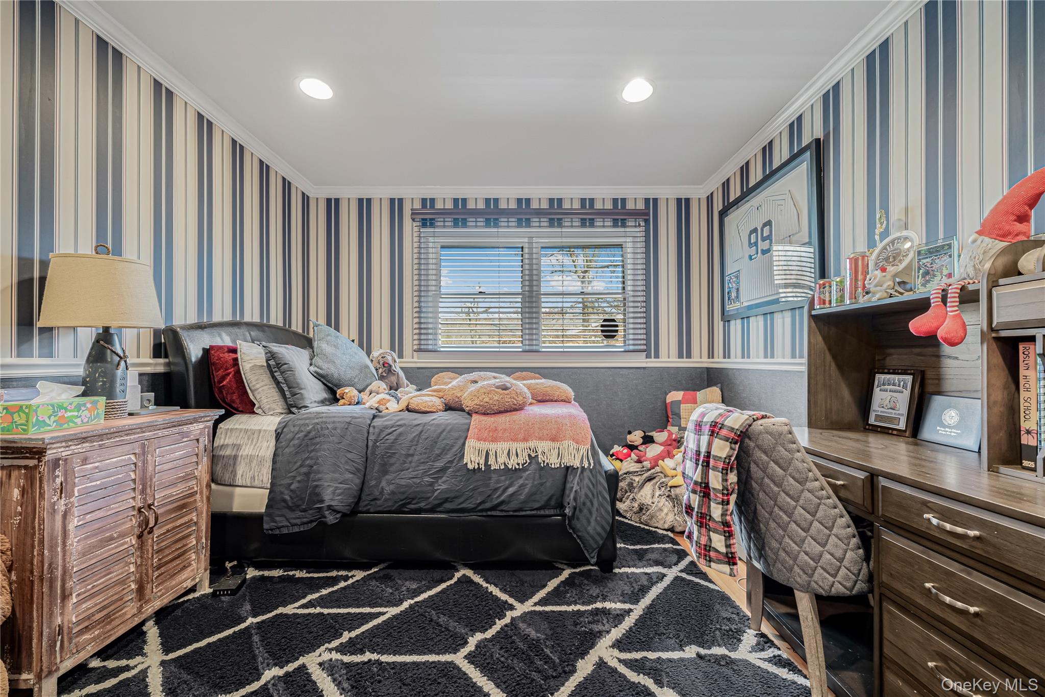 18 Woodland Road Roslyn, NY 11576 - Photo 10 of 21 a bed room with a bed and a fireplace