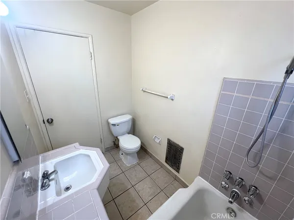 a bathroom with a sink and toilet