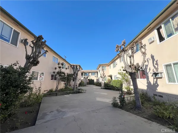 a view of a street with big house