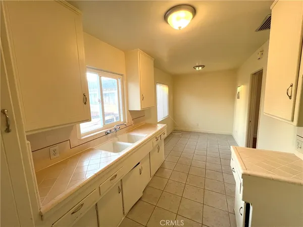 a large bathroom with a sink a large mirror and a bathtub