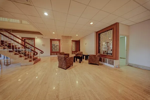 a living room with furniture and a large window