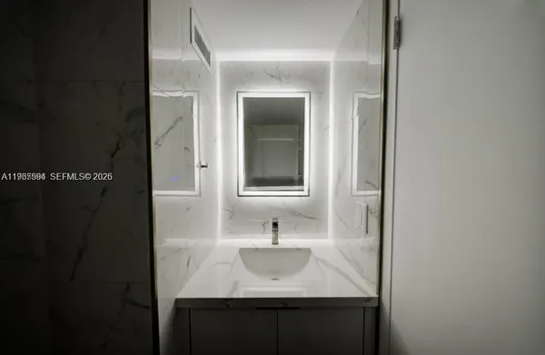 a sink with a mirror