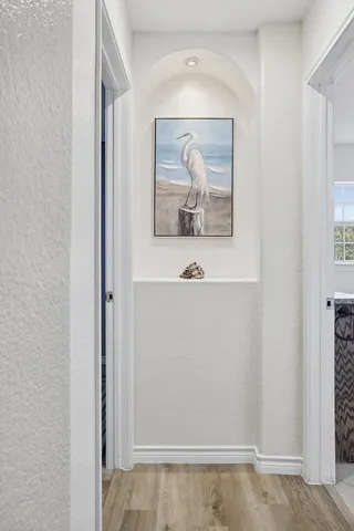 a bedroom with a bed and a chair