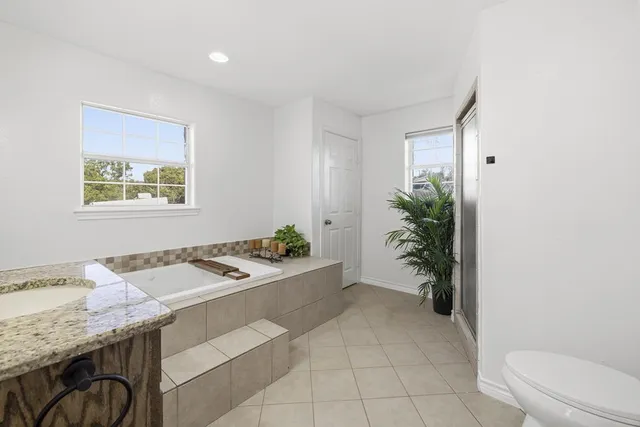 a bedroom with a bed and furniture