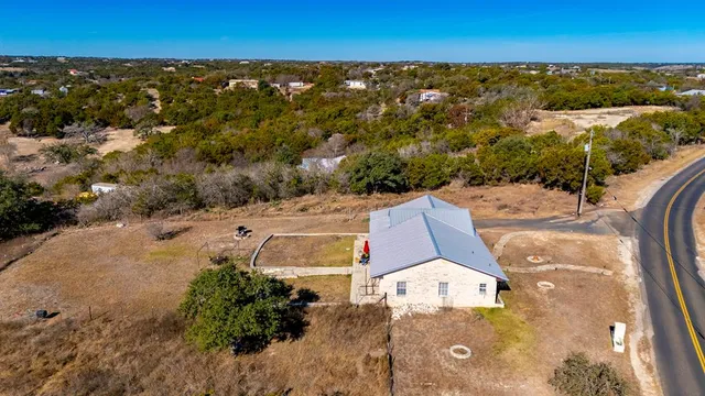 an aerial view of a house with a garden