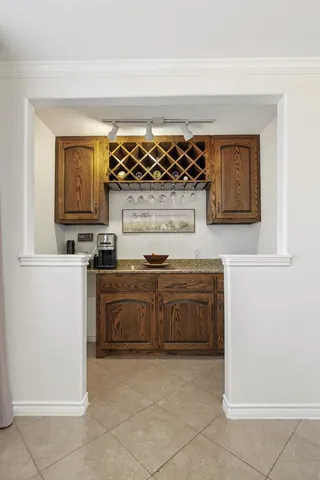 a kitchen with a stove top oven and cabinets