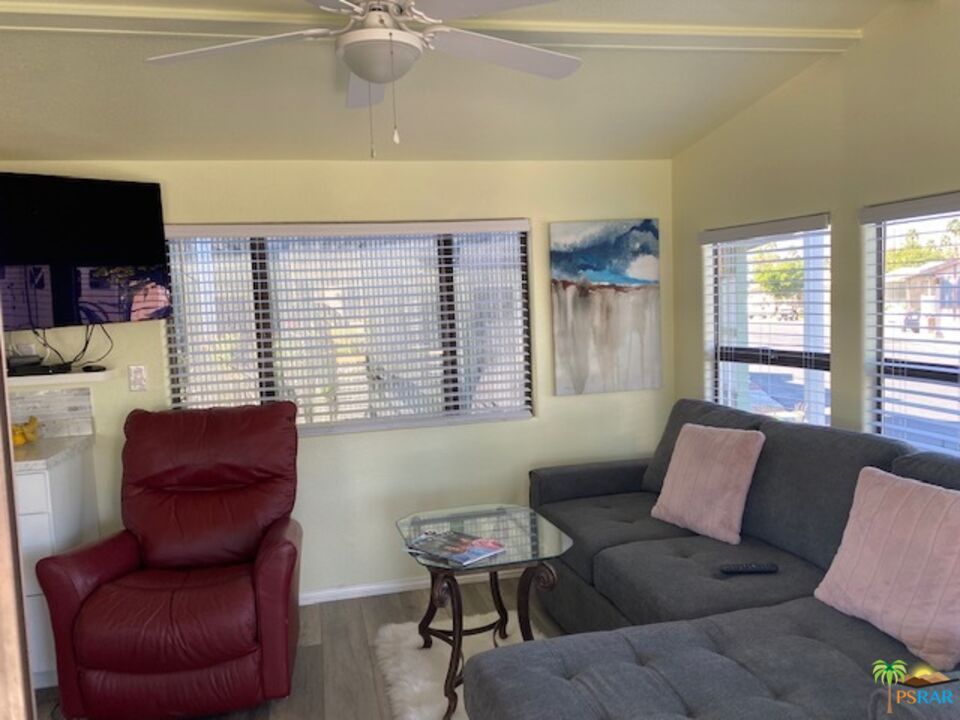 69801 Ramon Road, Unit 161 Cathedral City, CA 92234 - Photo 2 of 9 a living room with furniture and a large window