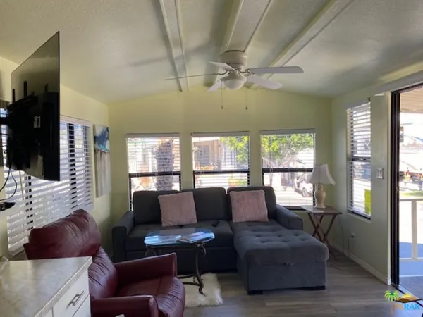 a living room with furniture and a large window