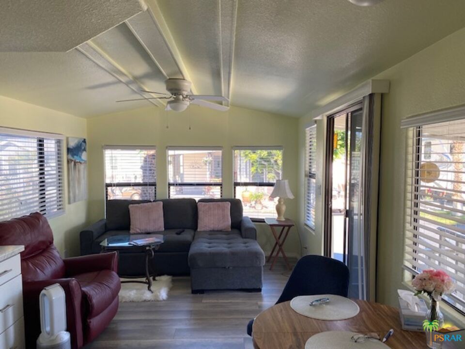 69801 Ramon Road, Unit 161 Cathedral City, CA 92234 - Photo 4 of 9 a living room with furniture and a window