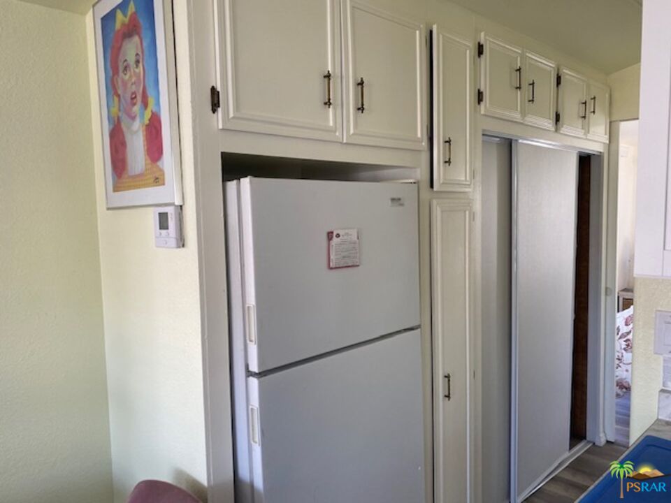 69801 Ramon Road, Unit 161 Cathedral City, CA 92234 - Photo 6 of 9 a white refrigerator freezer and a cabinets