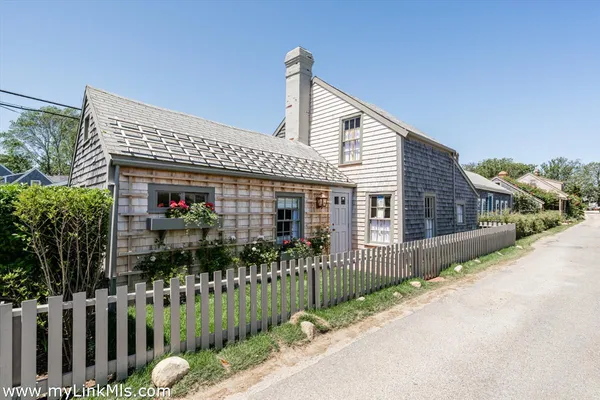 a front view of house along with street