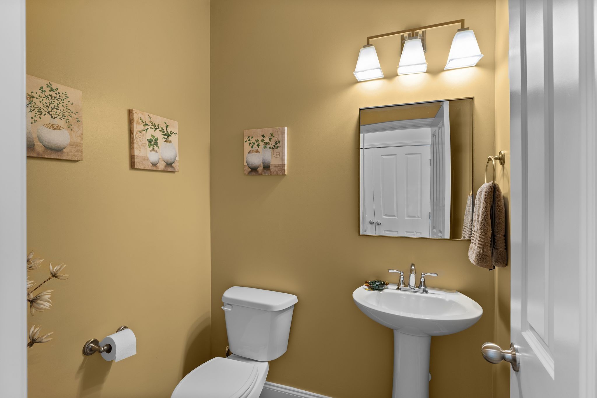 1247 June Wilde Ridge Spring Hill, TN 37174 - Photo 16 of 47 a bathroom with a toilet sink and mirror