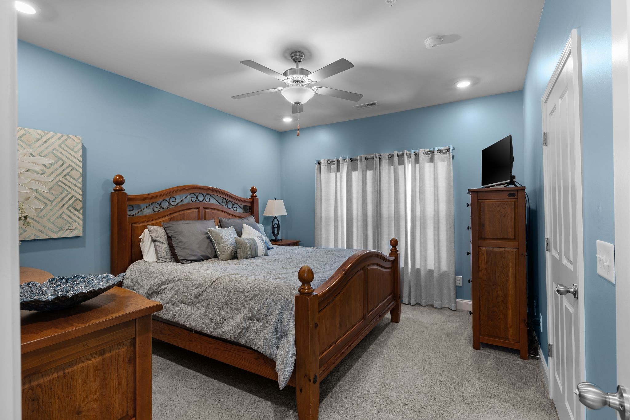 1247 June Wilde Ridge Spring Hill, TN 37174 - Photo 17 of 47 a bedroom with a bed and a chandelier