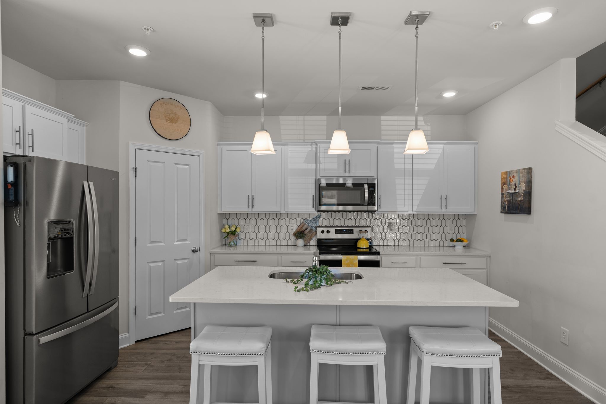 1247 June Wilde Ridge Spring Hill, TN 37174 - Photo 10 of 47 a kitchen with kitchen island appliances and a counter top space