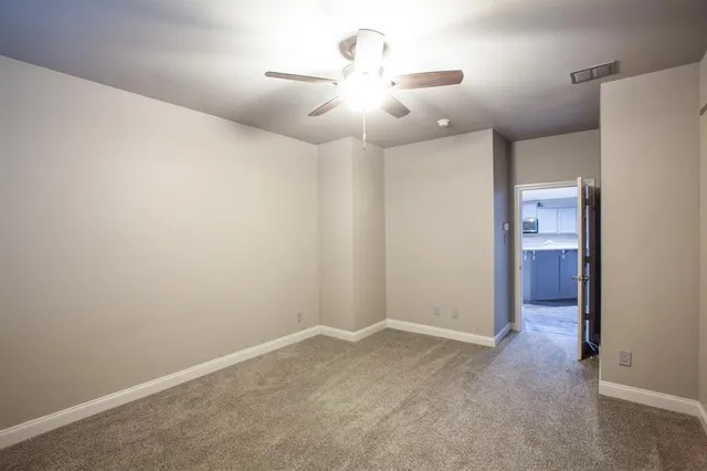a kitchen with cabinets stainless steel appliances and window
